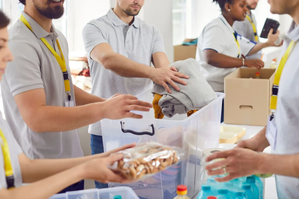 AFG - Understanding deferred income for not-for-profit organisations Volunteers working humanitarian aid center diverse